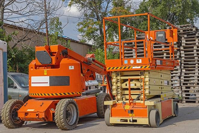 forklift maneuvering through a warehouse with stocked shelves in Glenshaw